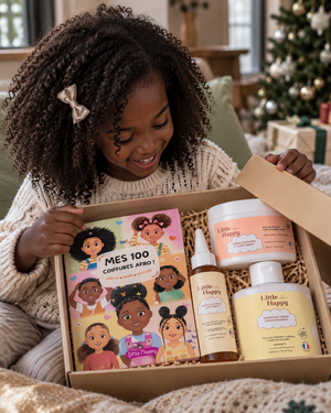  Enfant ouvrant son coffret de Noël Little Happy Hair 